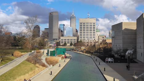 Establishing-aerial-drone-shot-of-downtown-city-skyline-and-riverfront-walk-Indianapolis-Indiana