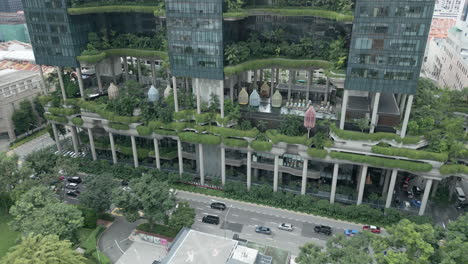 wide aerial of a green high rise, parkroyal is a iconic eco friendly and stunning hotel in-a garden concept that incorporates energy saving features and environmentally friendly technologies