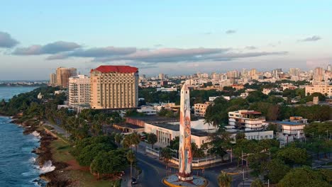 obelisk in juan baron plaza and amusement park along malecon at sunrise, santo domingo in dominican republic