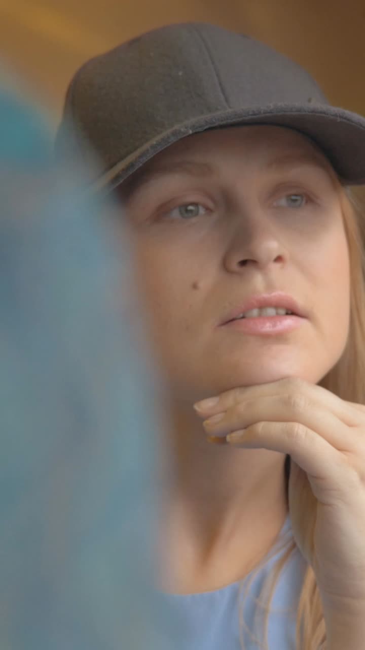 Woman with Hat Taking Photos