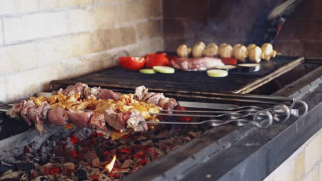 cooking meat on fire. grilling marinated meat on grill