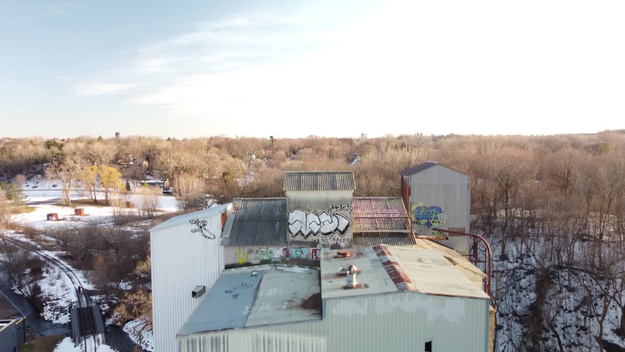 Drone tilting up to reveal abandoned grain elevator in Minneapolis, MN
