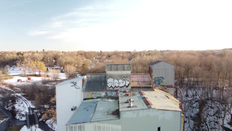 drone tilting up to reveal abandoned grain elevator in minneapolis, mn