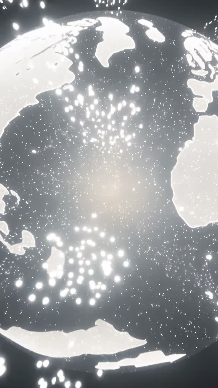 Video verticale: Particelle luminose che convergono formando una sfera in un vuoto oscuro, rivelando i contorni della terra.