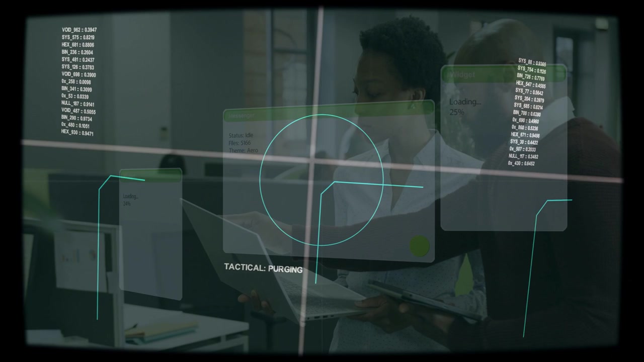 Vertical video: HUD appearing two staff checking monitor tablet data at desk in blouse and sweater