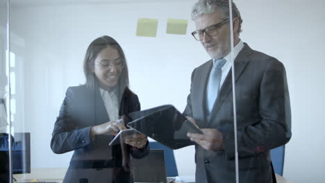 female project manager and male boss sticking paper notes