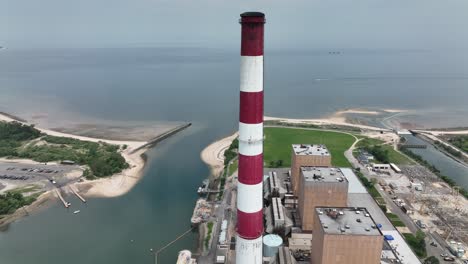 an aerial view of a power generation facility on a sunny day with hazy skies