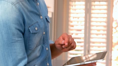 Man-using-his-tablet