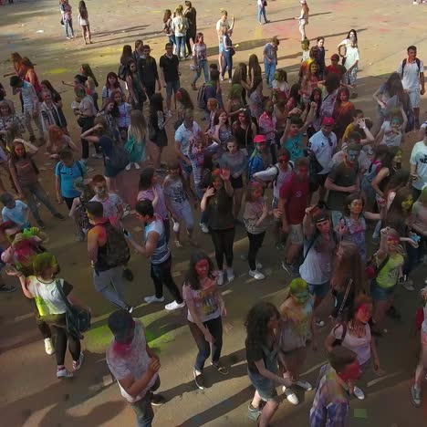 festival of color in a city park. vinnitsa, ukraine - july 2017: people have fun during the festival of color in a city park in vinnitsa