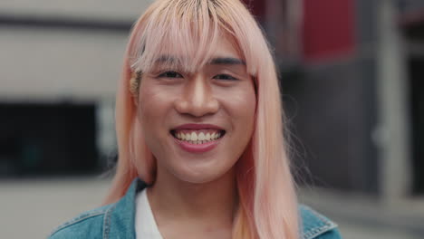 smiling person with pink hair