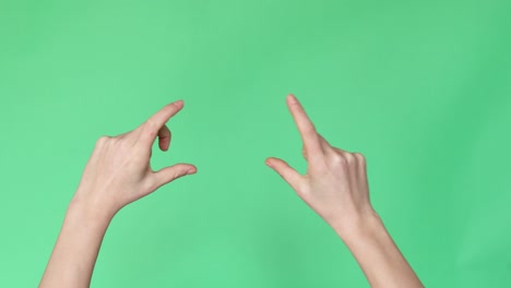 hands searching on screen on green background