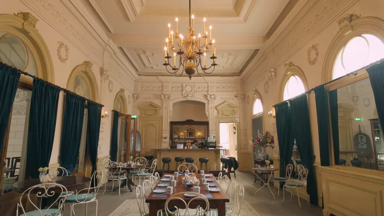 Elegant Restaurant Interior with Bar and Chandelier