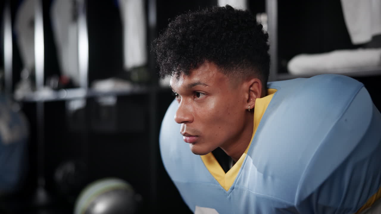 Football player portrait in locker room