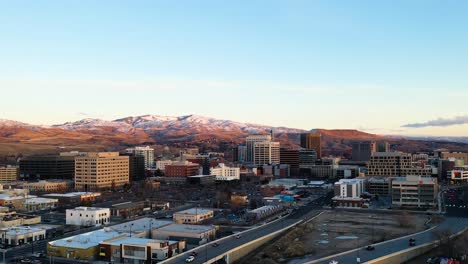 Aerial-time-lapse-traveling-over-Boise,-Idaho-at-sunrise