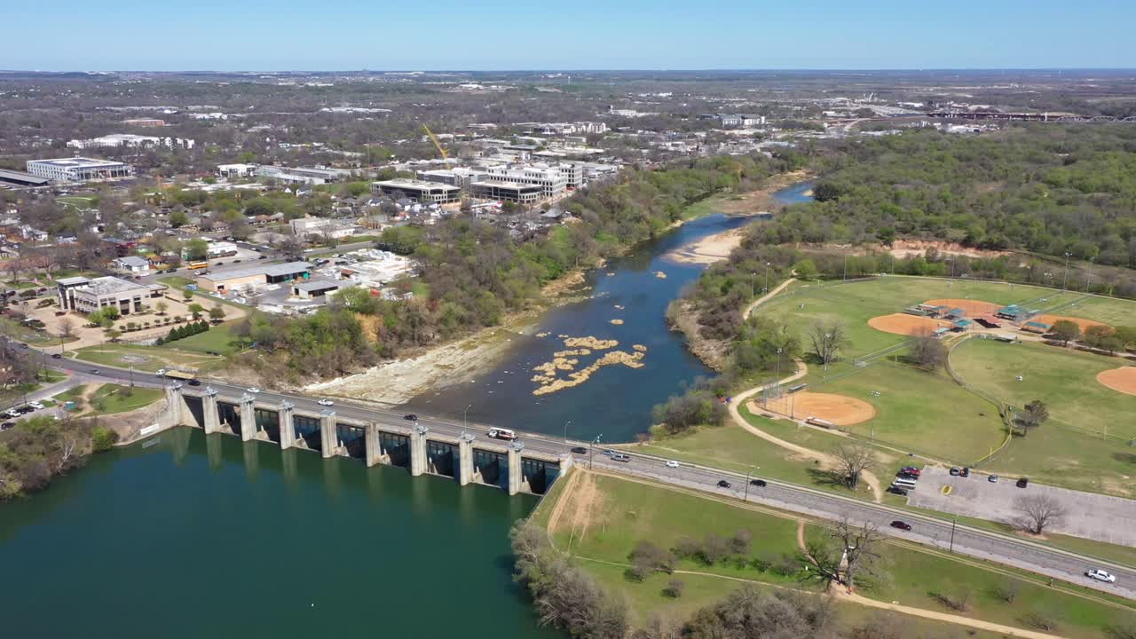 Drone is flying over bridge at the start of the river
