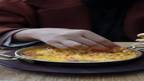 a person eating turkish breakfast menemen with bread