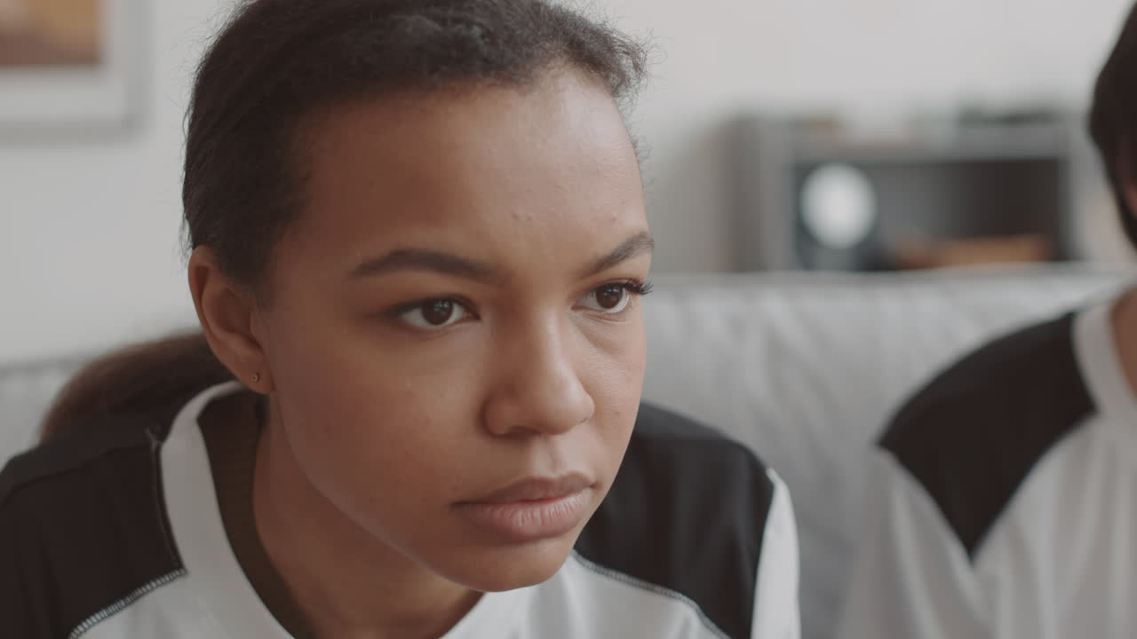 Nervous Mixed-Race Woman Watching Movie
