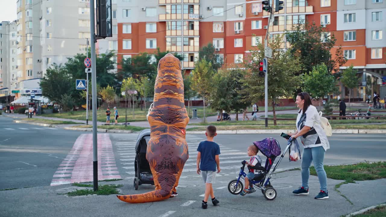Man in dinosaur costume. Man dressed in a funny blow up dinosaur costume