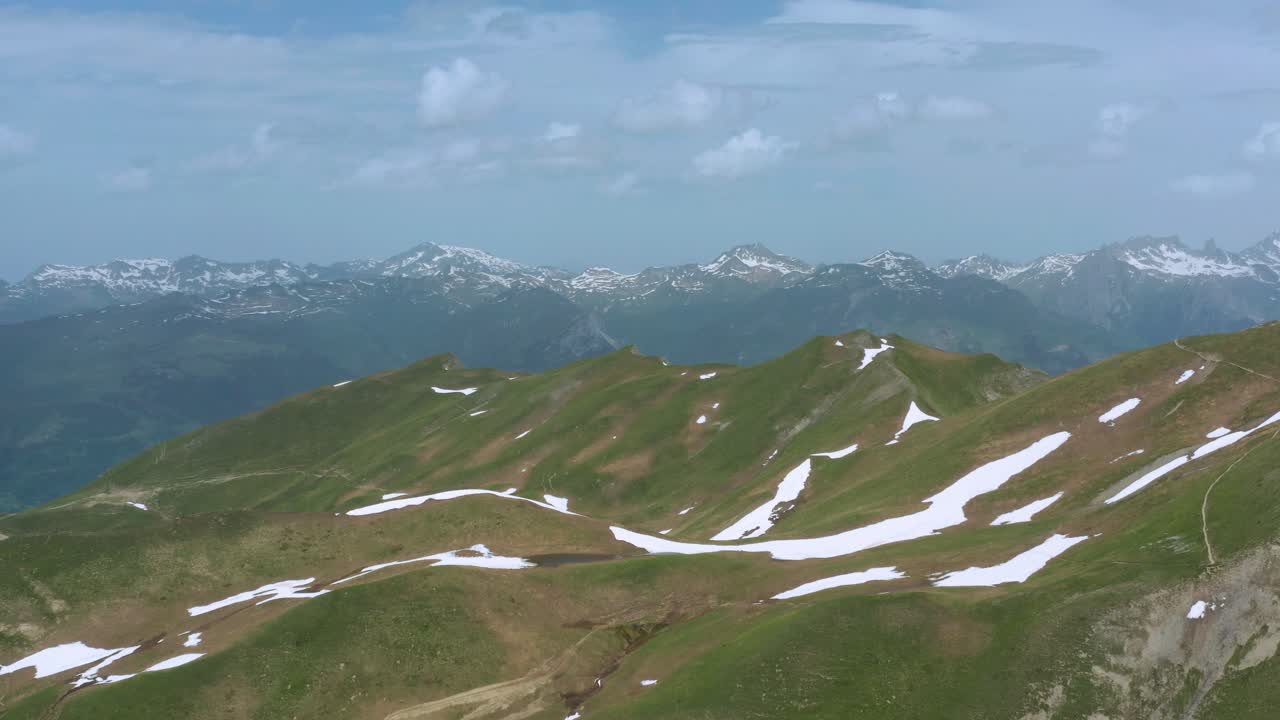 Scenery Of Snowy Slopes Mountains Near Little Saint Bernard Pass With Mont Blanc At Background In France. - Aerial Wide Shot