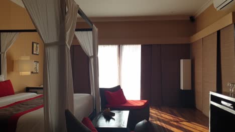 panning of interior of hotel room with canopy bed