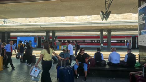 travelers waiting and moving at turin station