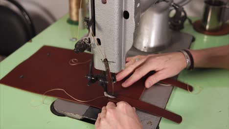 leatherworking process with vintage sewing machine