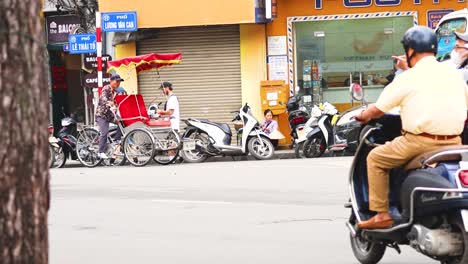 motorbikes and rickshaws navigate bustling hanoi street