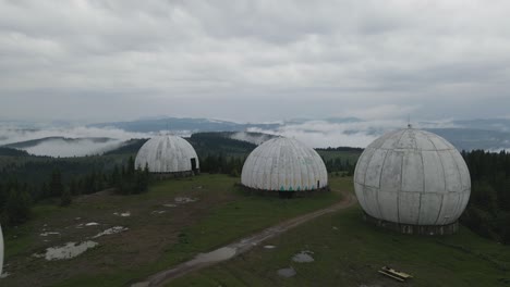 aerial shot flying fast through and over abandoned soviet radar station in ukraine