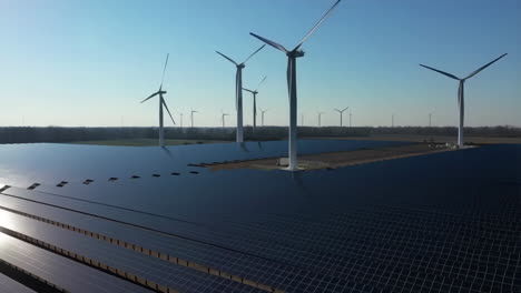 solar panels and wind turbines in a renewable energy field