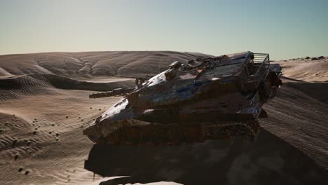 militairy tanks destructed in the desert at sunset
