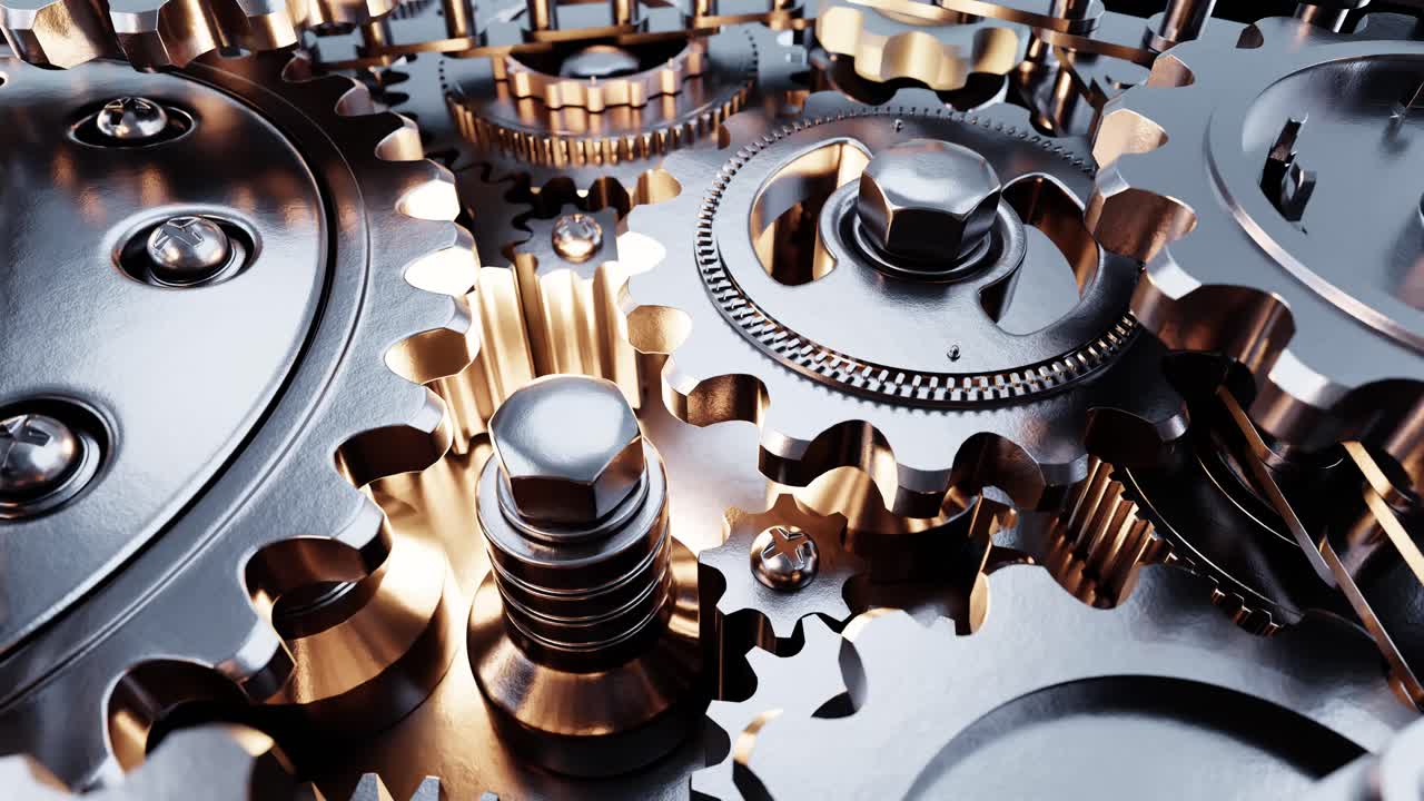 Close Up of Interlocking Metal Gears Turning Seamlessly