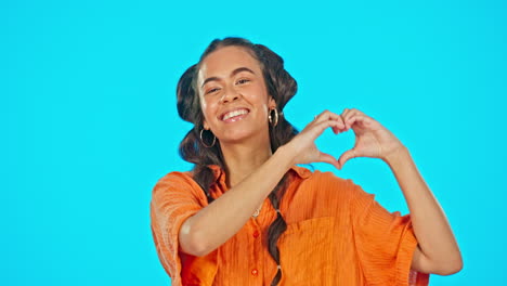 smile, love hand gesture and woman on studio