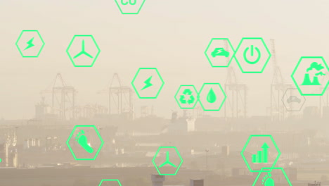 multiple green energy icons floating against aerial view of cityscape