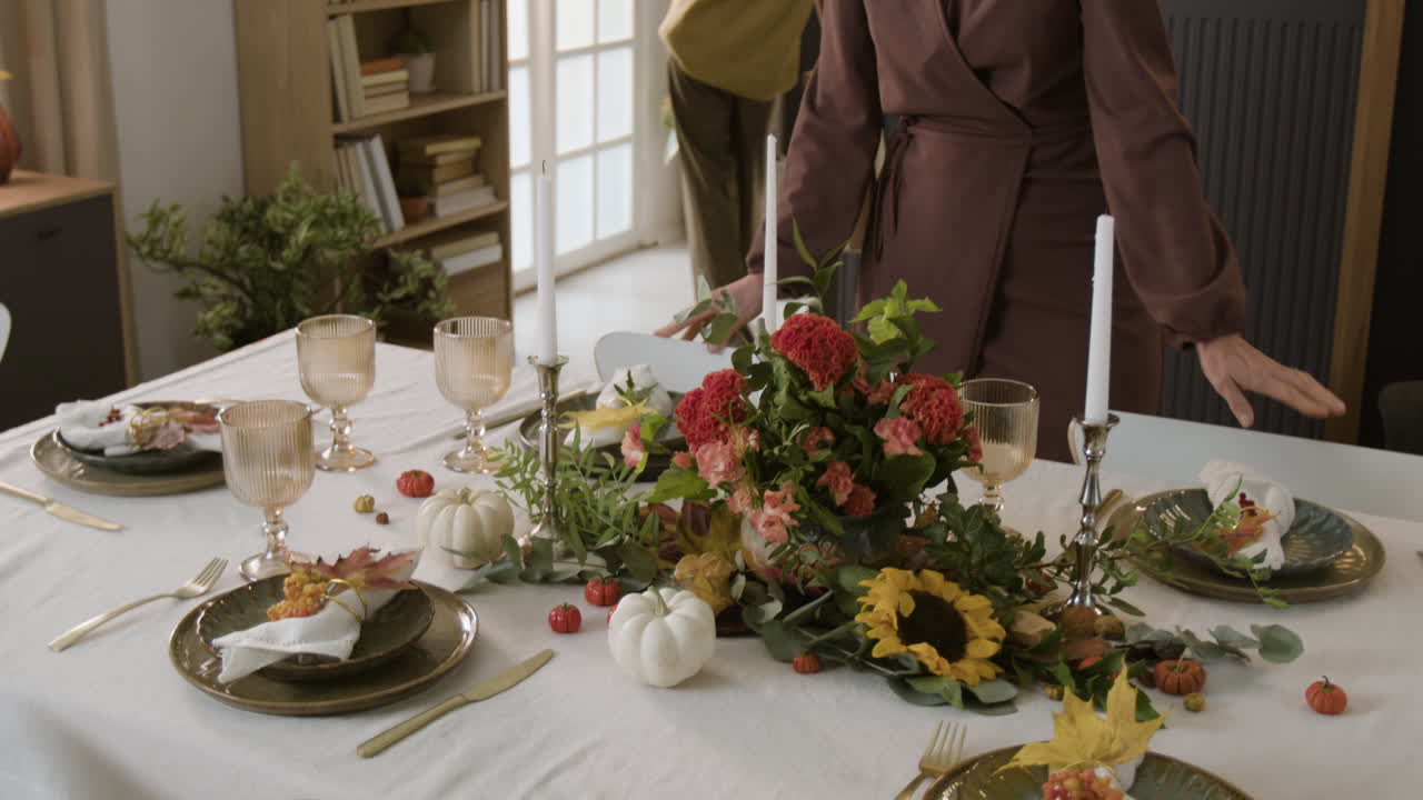 Festive Fall Table Setting with Flowers and Pumpkins