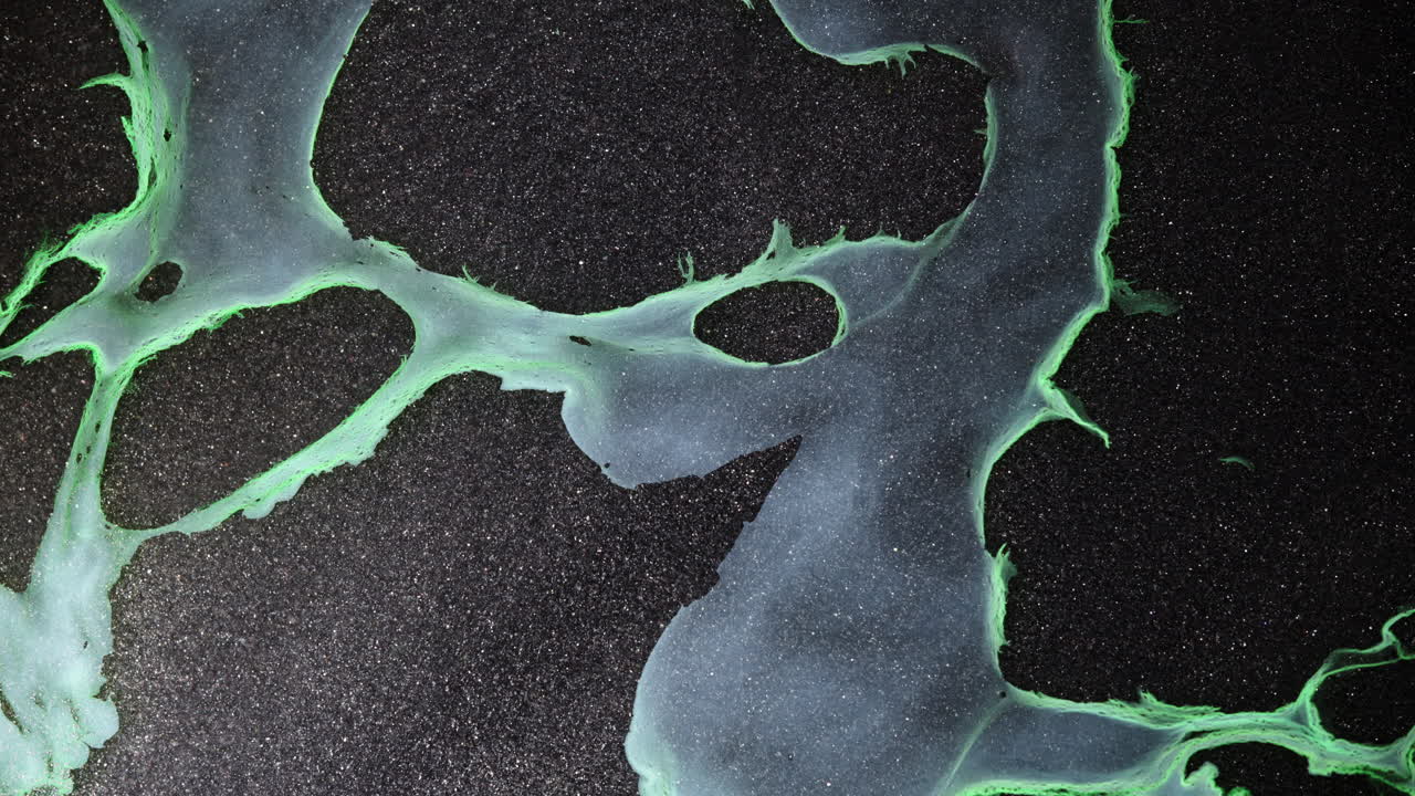 Macro shot of colorful ink swirling, creating abstract patterns