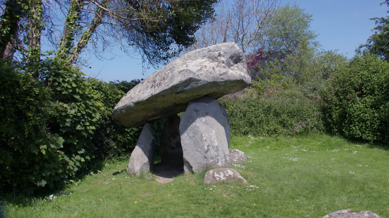 Panning Wide shot right to left of Carreg Coetan Arthur Chambered Tomb