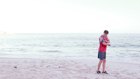 Attractive-man-running-on-the-beach