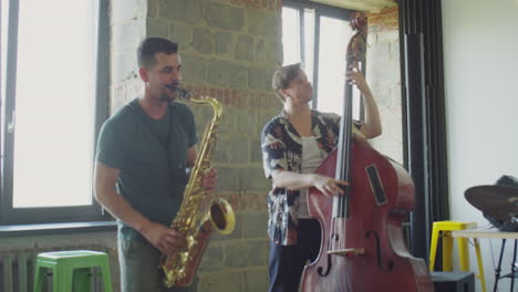 jazz musicians playing instruments and rehearsing in a studio