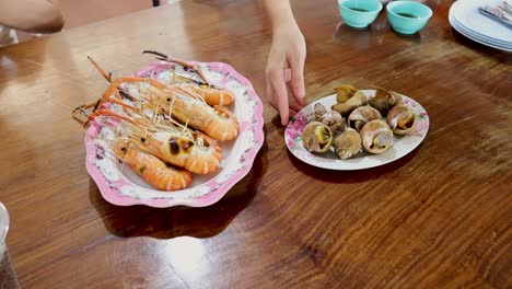 setting up and enjoying a seafood meal together