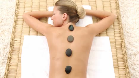 Attractive-woman-lying-on-massage-table-at-spa