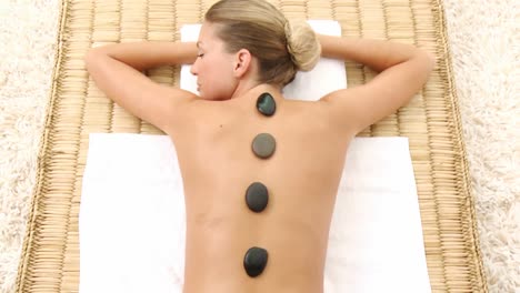 attractive woman lying on massage table at spa