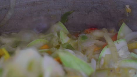 closeup of a boiling saute of vegetables