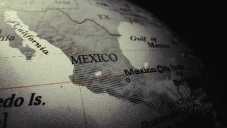 close-up of a world globe with a focus on mexico