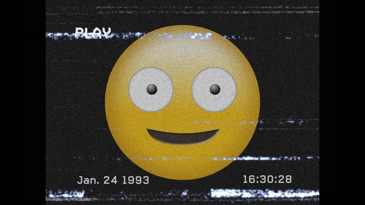 Digital animation of vhs effect over silly face emoji on black background