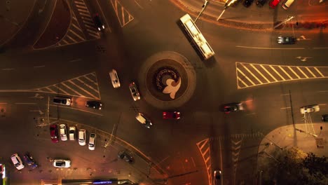 traffic circle with cars. top down aerial view on a circular intersection,