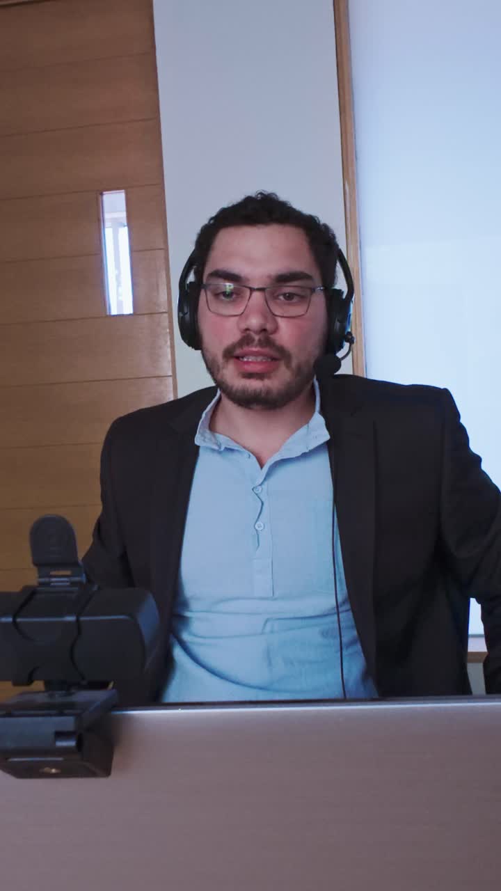 Man Adjusting His Suit During an Online Business Call