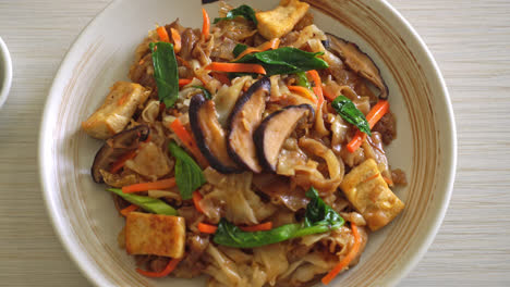 stir-fried noodles with tofu and vegetables - vegan and vegetarian food style