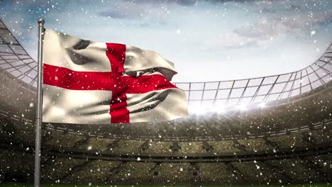 english flag waving in the snow in full arena