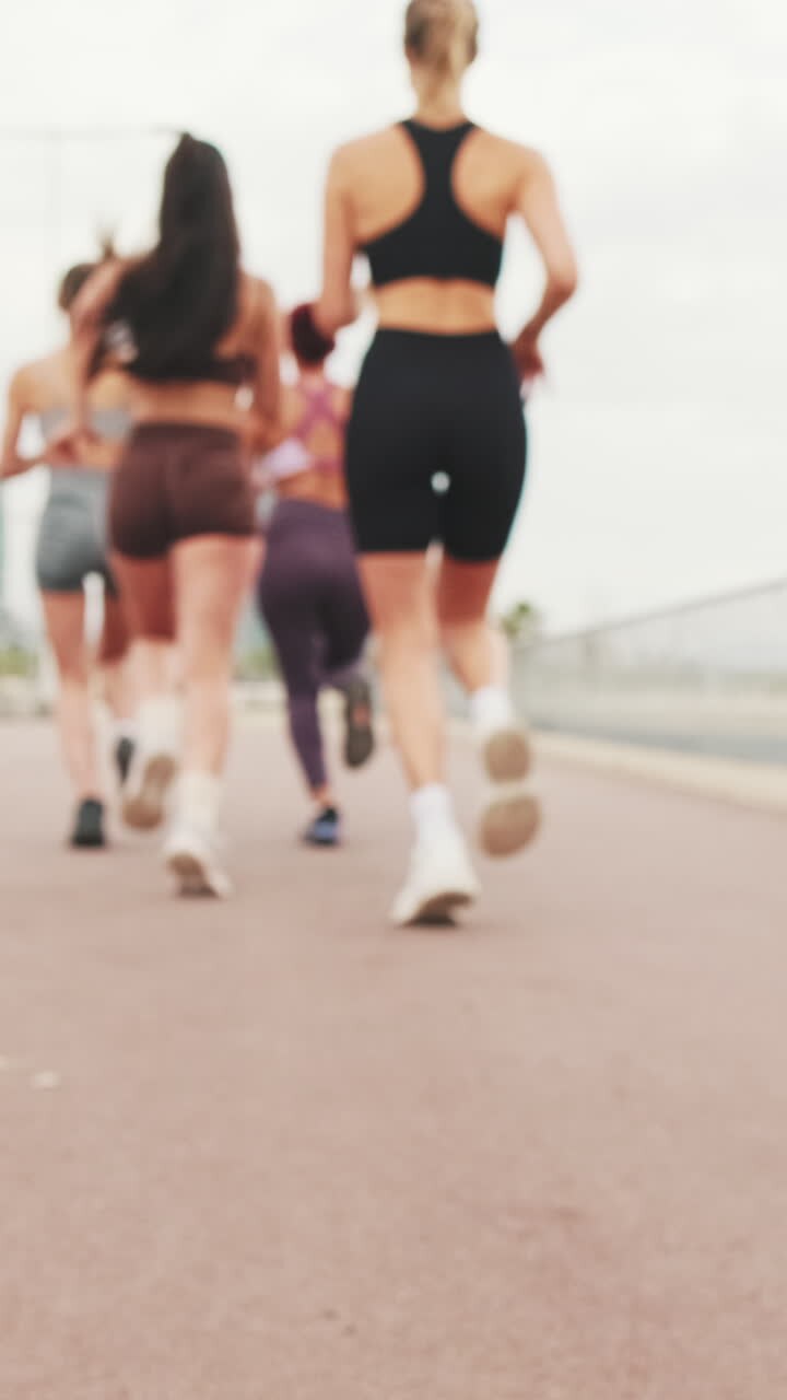 Four Girls Jogging in the City
