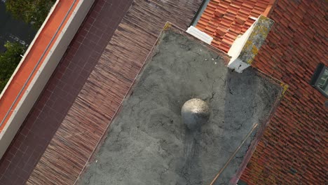 Drone-top-down-shot-of-a-unique-roof-of-the-residential-buidling